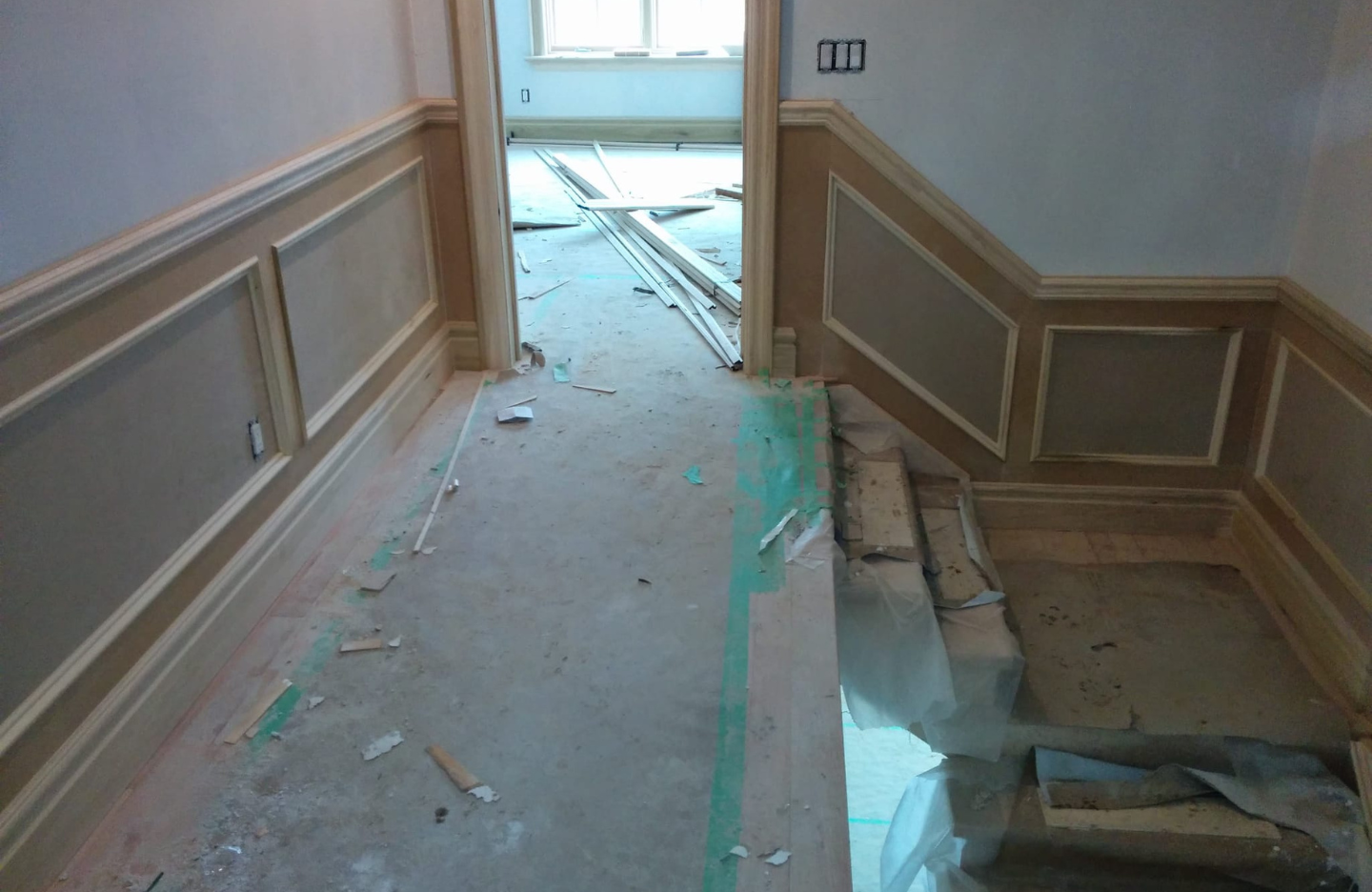 A hallway is being remodeled in a house.