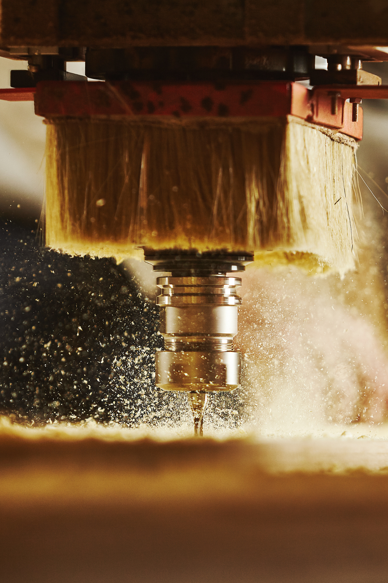 A cnc machine is being used to make a piece of wood.