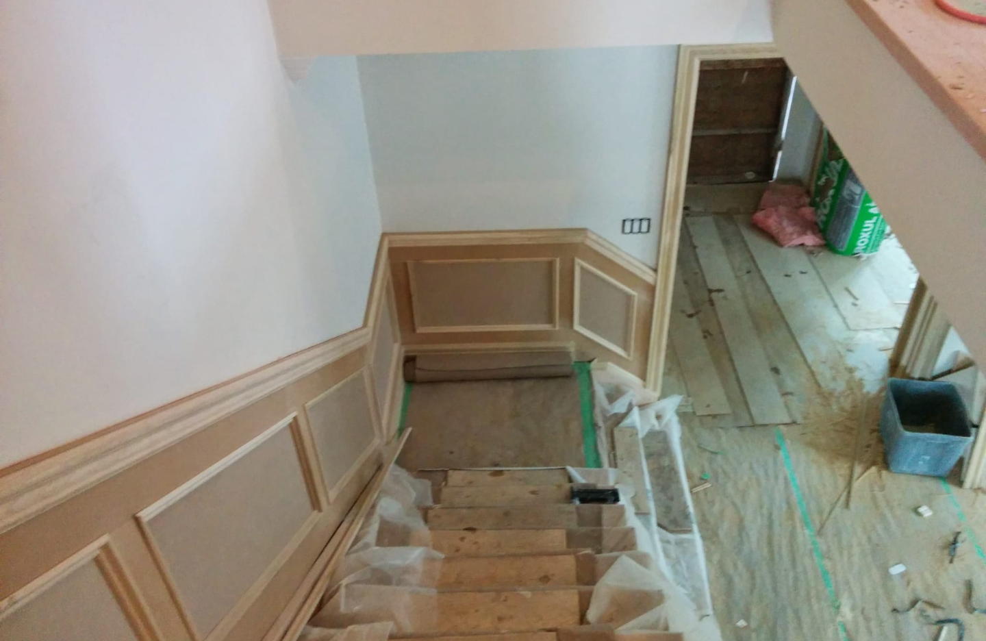 A staircase is being remodeled in a house.