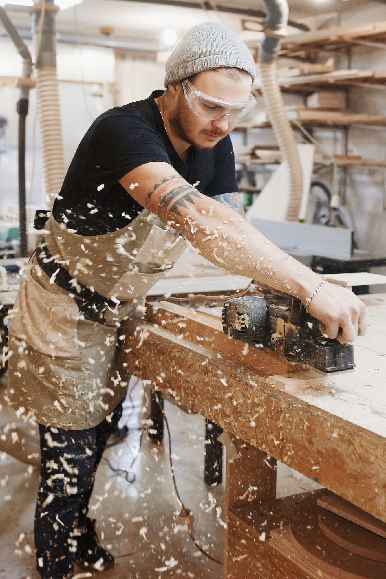 A man working in a woodworking shop.