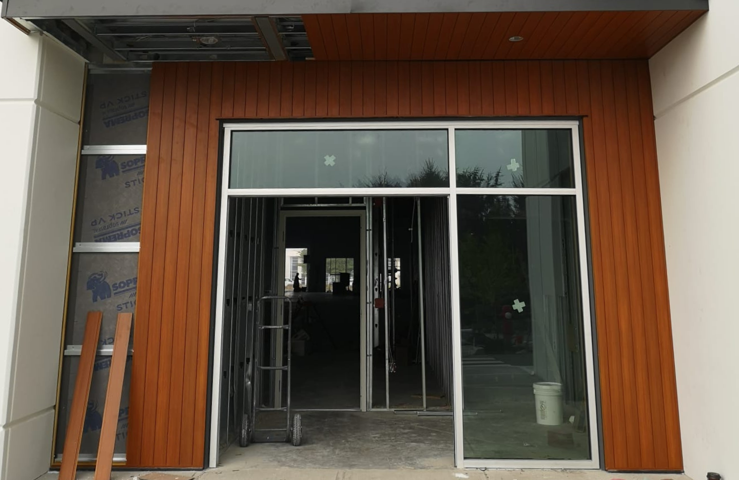 The entrance to a building with a wooden door.